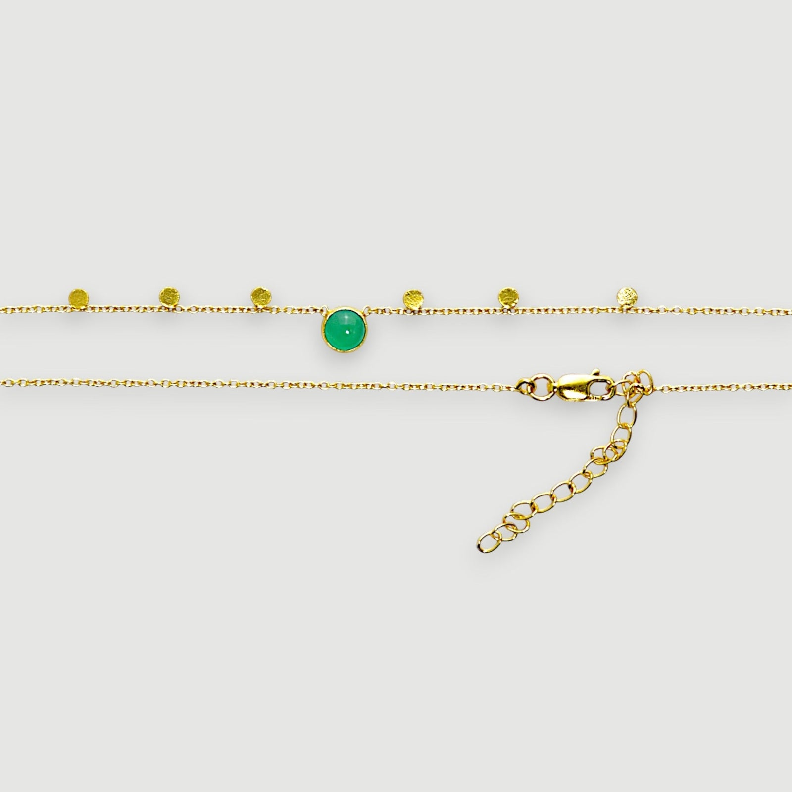 Amara Jewels green chalcedony charm necklace in 18K gold vermeil over sterling silver with coin charms.