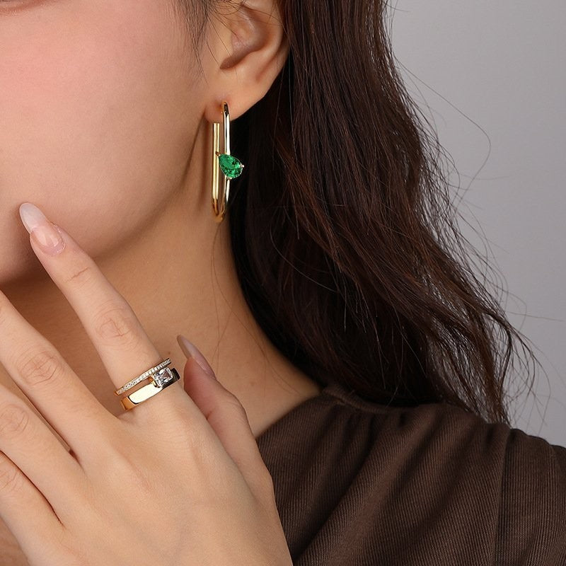 Amara Jewels gold-plated sterling silver hoop earrings with emerald green gemstones and clear CZ stones.
