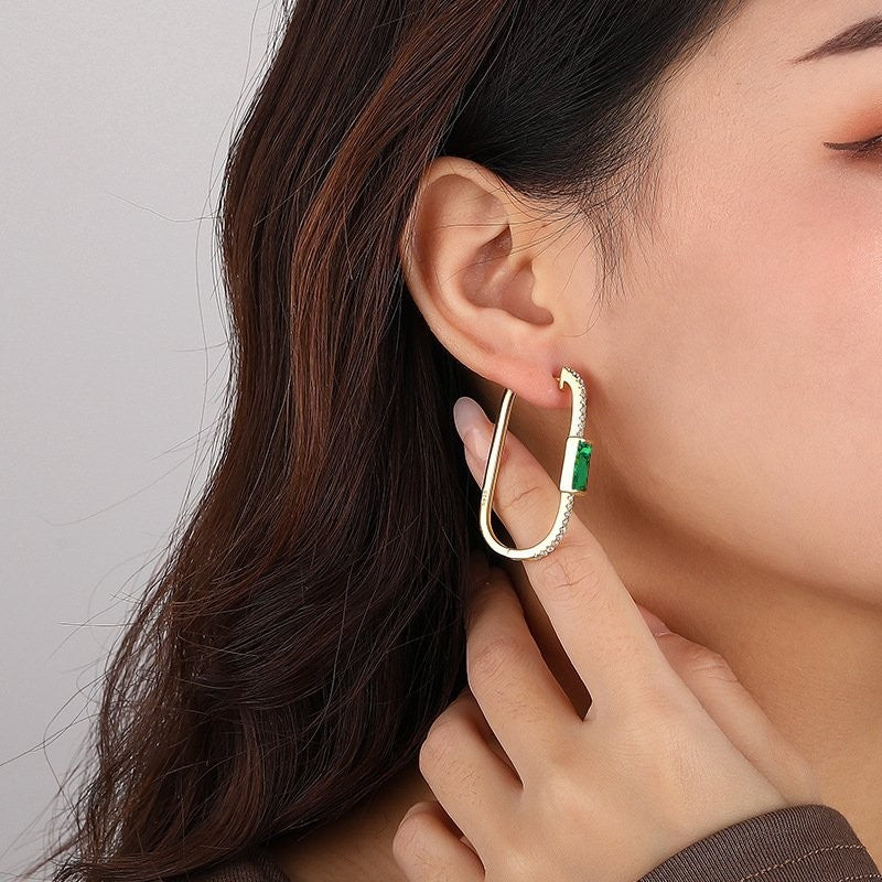 Amara Jewels gold-plated sterling silver hoop earrings with emerald green gemstones and clear CZ stones.