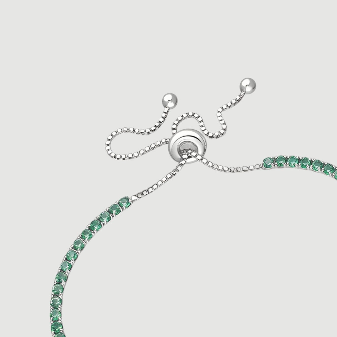 Amara Jewels sterling silver adjustable tennis bracelet with forest green gemstones and a slider clasp.