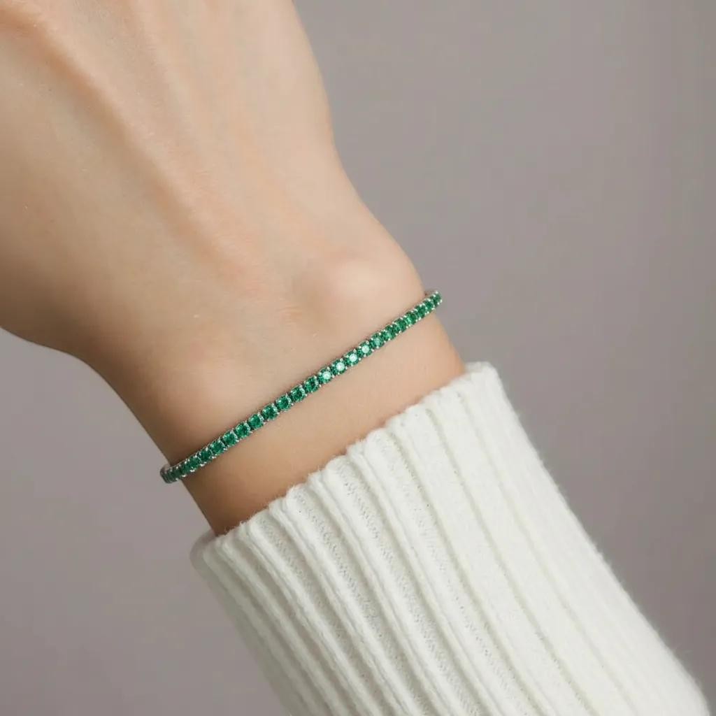 Amara Jewels sterling silver adjustable tennis bracelet with forest green gemstones and a slider clasp.