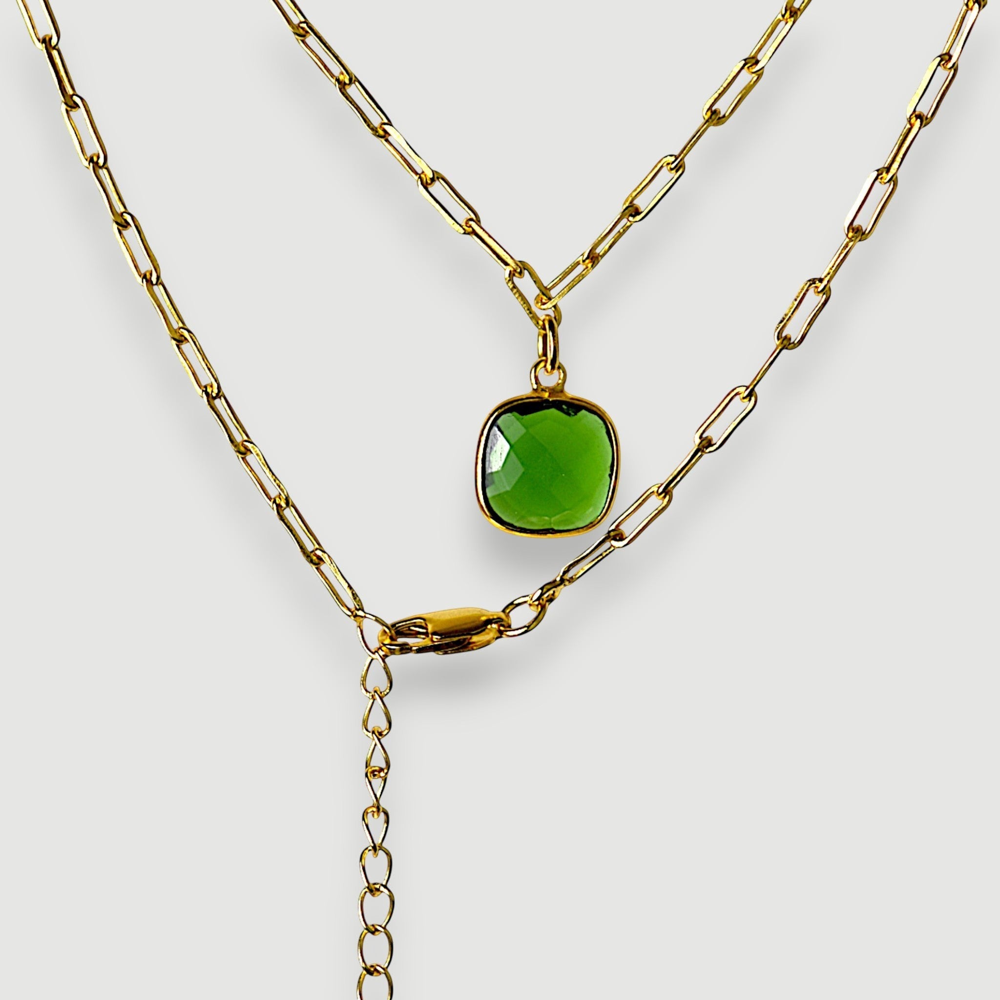 Amara Jewels green faceted cushion-cut green onyx gemstone pendant necklace on a gold paperclip chain.