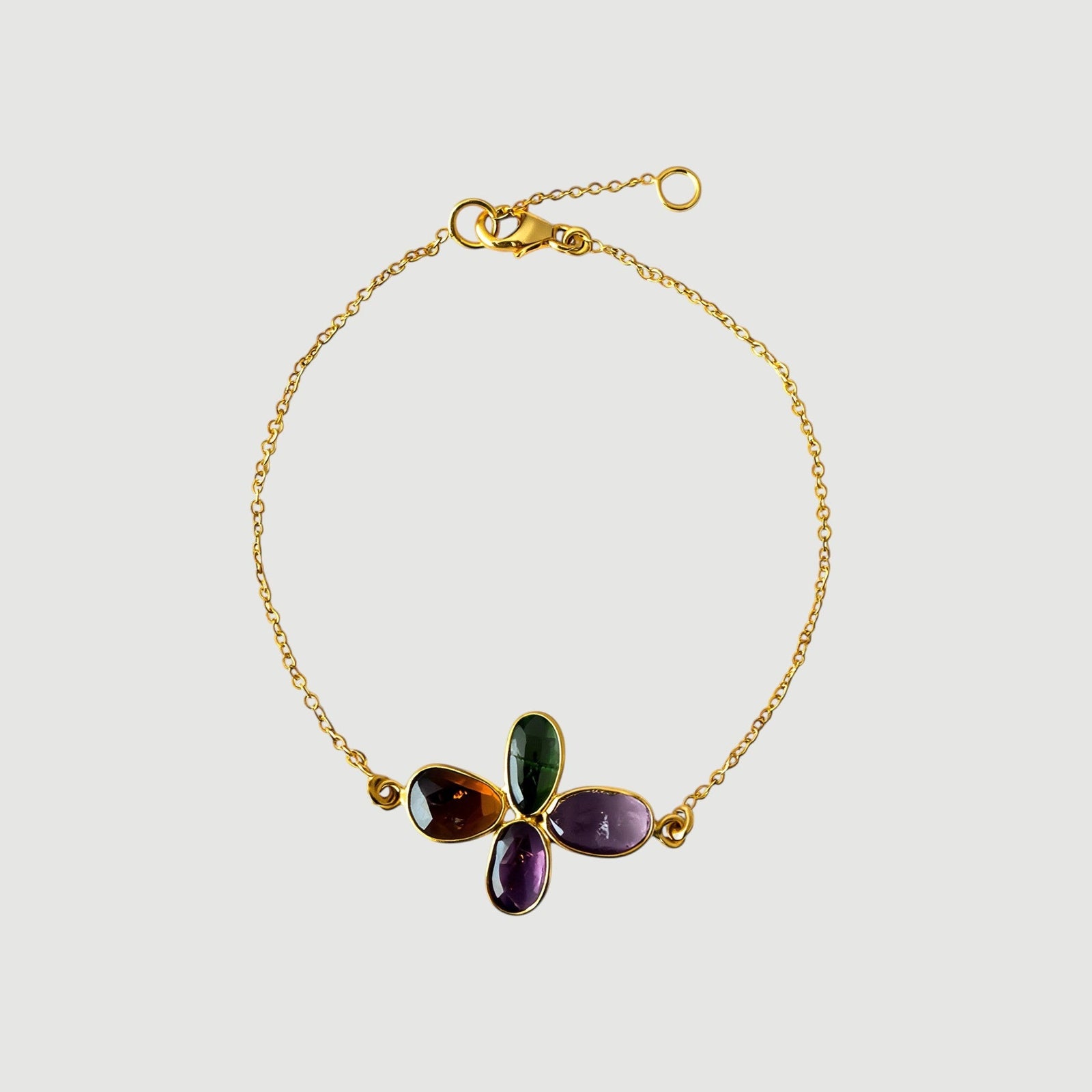 Amara Jewels Harmony Gemstone Bracelet in gold vermeil sterling silver with multi-colored natural gemstones arranged in a floral pattern.