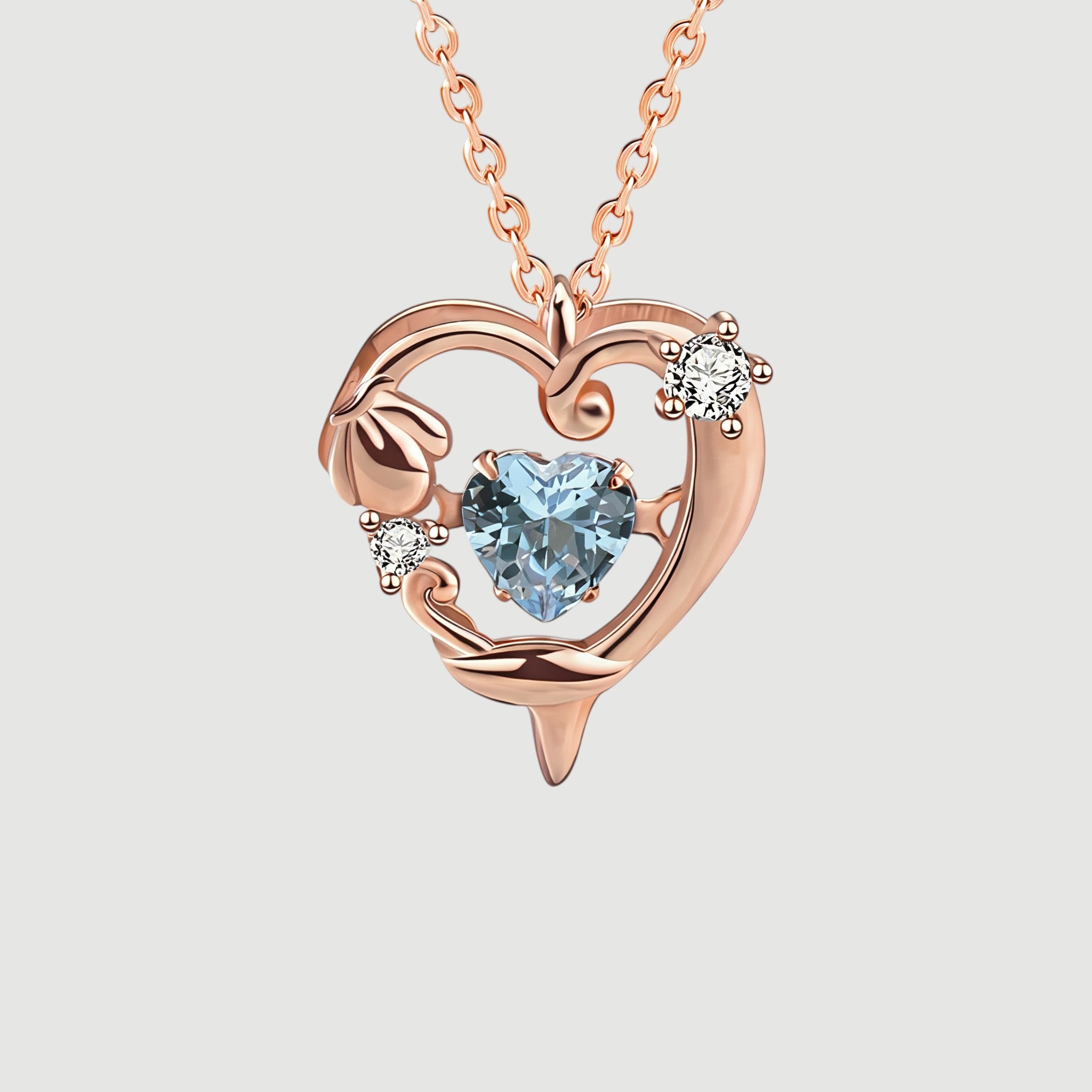 Amara Jewels rose gold plated sterling silver necklace with a heart-shaped aquamarine pendant and crystal accents.