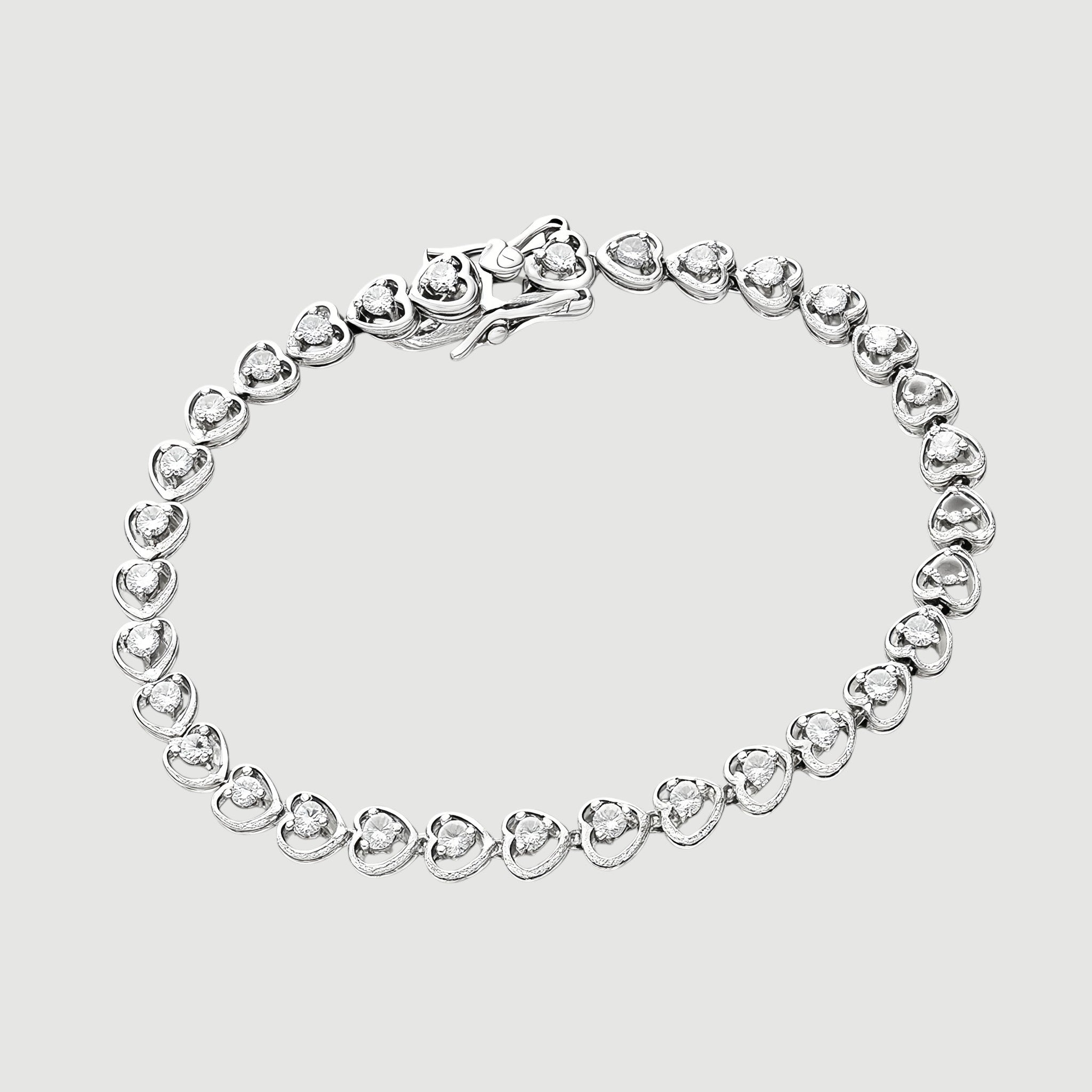 Amara Jewels 925 sterling silver bracelet with delicate heart-shaped links and cubic zirconia accents, secured with a lobster clasp.