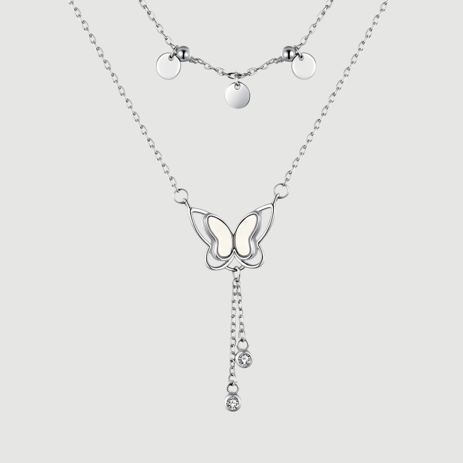 Amara Jewels double-layered sterling silver necklace with butterfly pendant and dangling crystals.