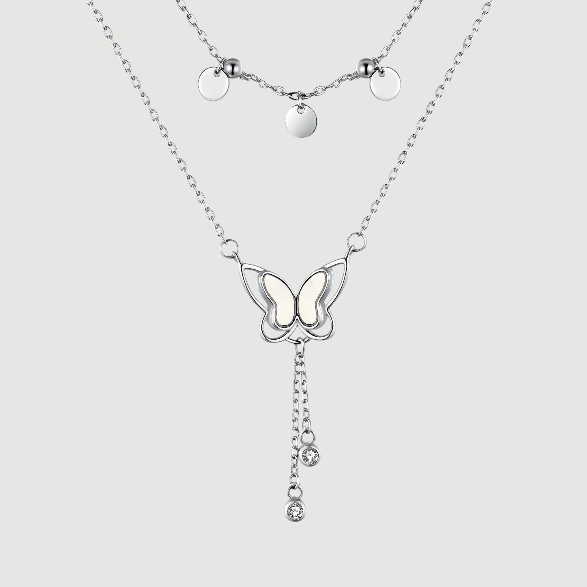 Amara Jewels double-layered sterling silver necklace with butterfly pendant and dangling crystals.