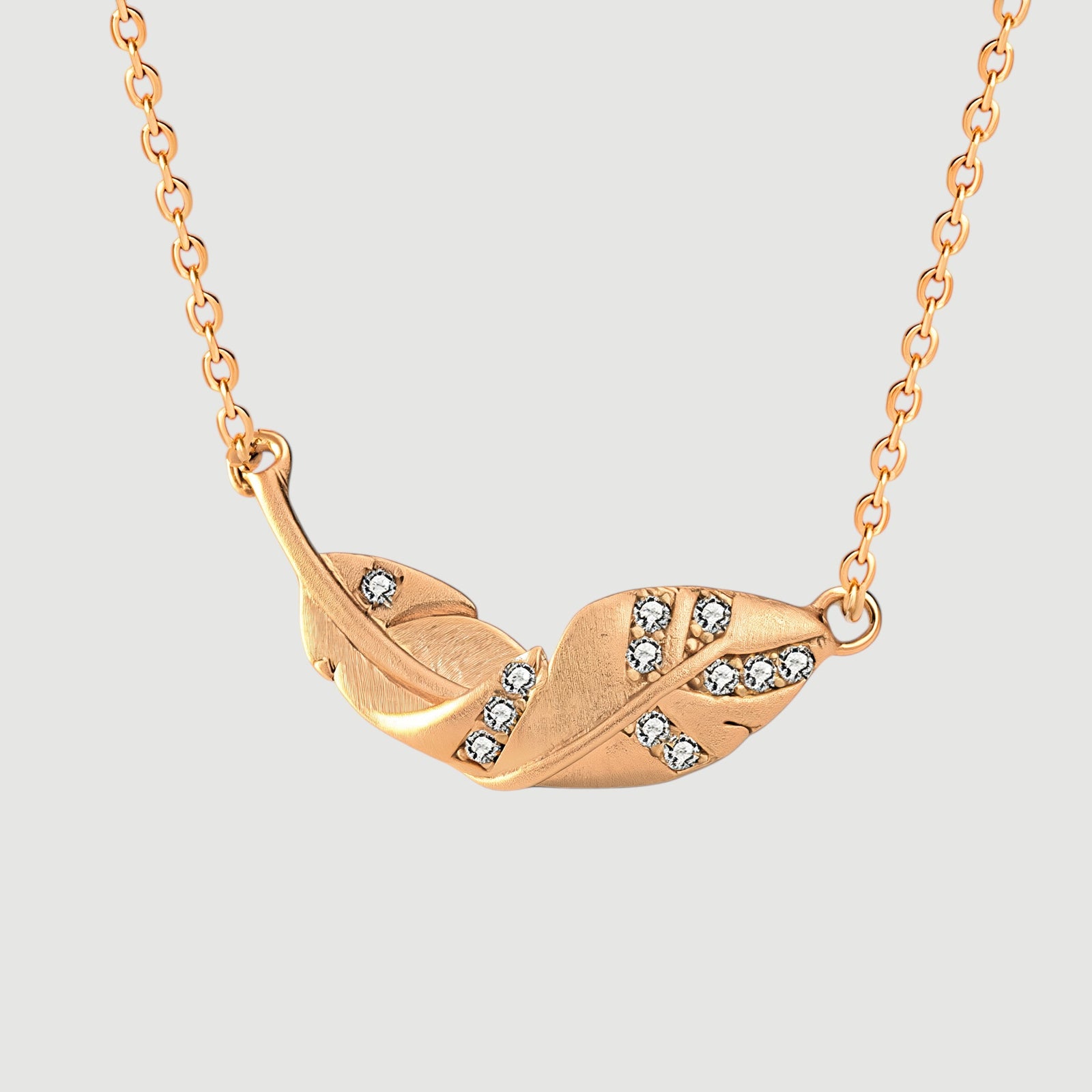 Amara Jewels gold-plated 925 sterling silver necklace with a leaf pendant adorned with cubic zirconia.