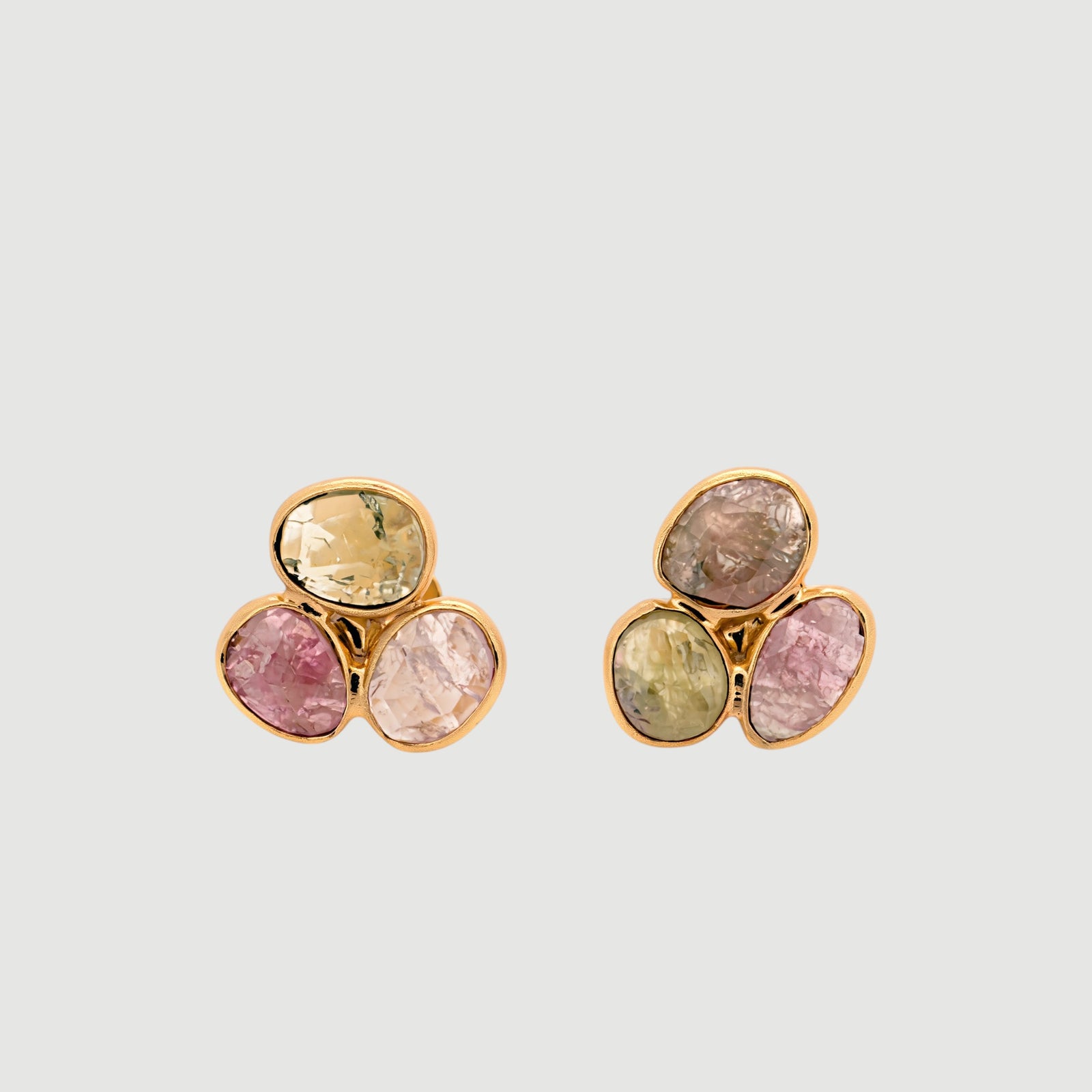 Amara Jewels natural multi-color tourmaline stud earrings in 18K gold vermeil over sterling silver. Features pink, green, and brown hues.