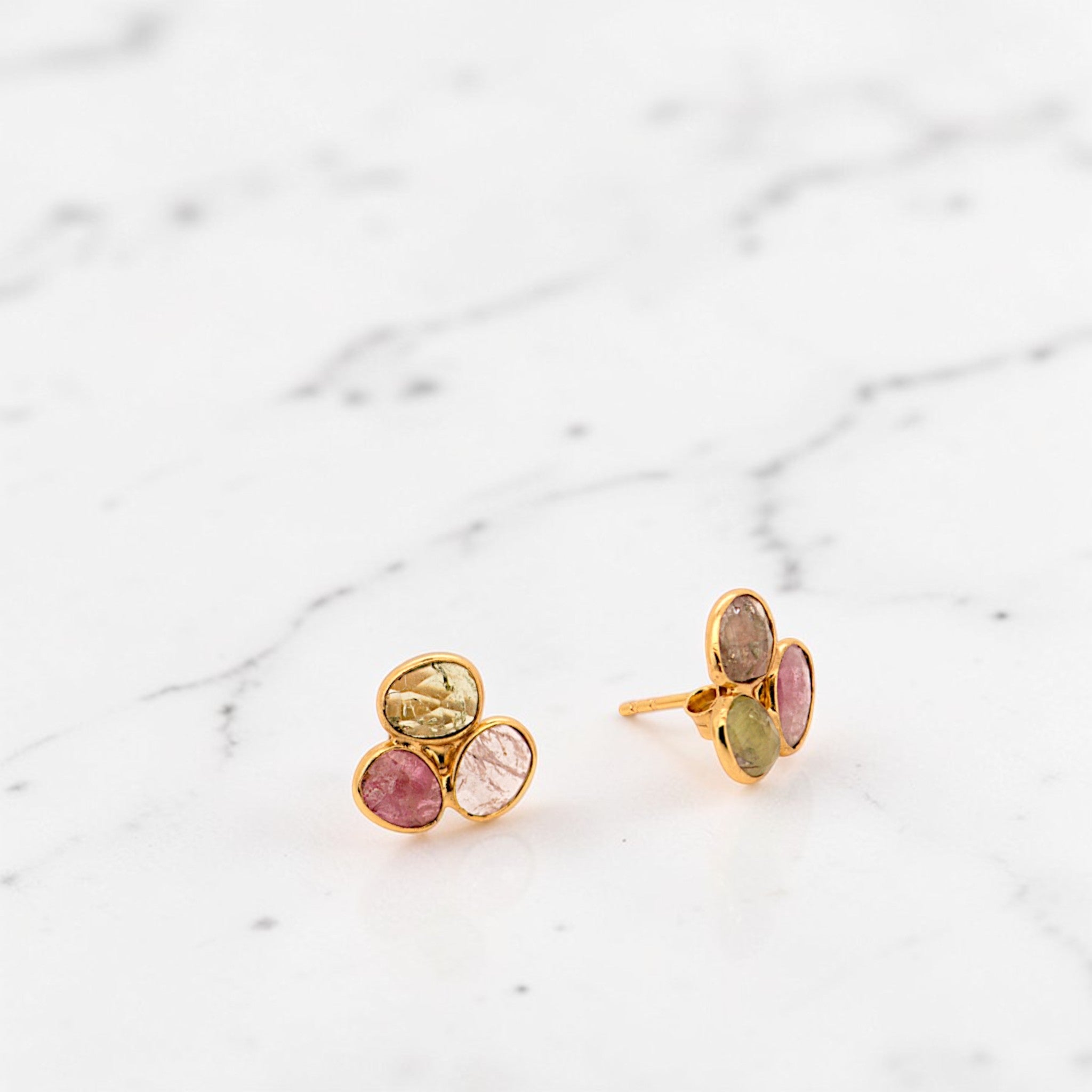 Amara Jewels natural multi-color tourmaline stud earrings in 18K gold vermeil over sterling silver. Features pink, green, and brown hues.
