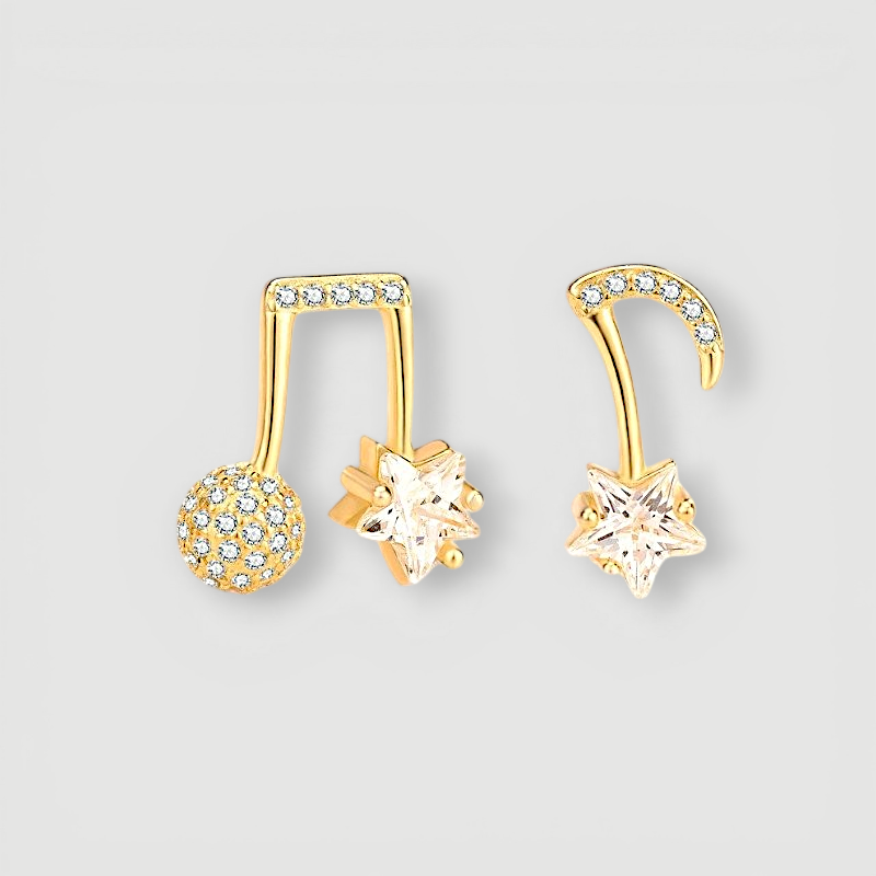 Amara Jewels gold-plated sterling silver asymmetrical music note and star earrings with cubic zirconia.