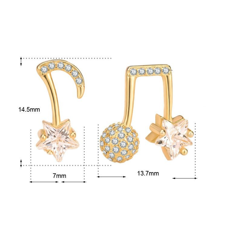 Amara Jewels gold-plated sterling silver asymmetrical music note and star earrings with cubic zirconia.