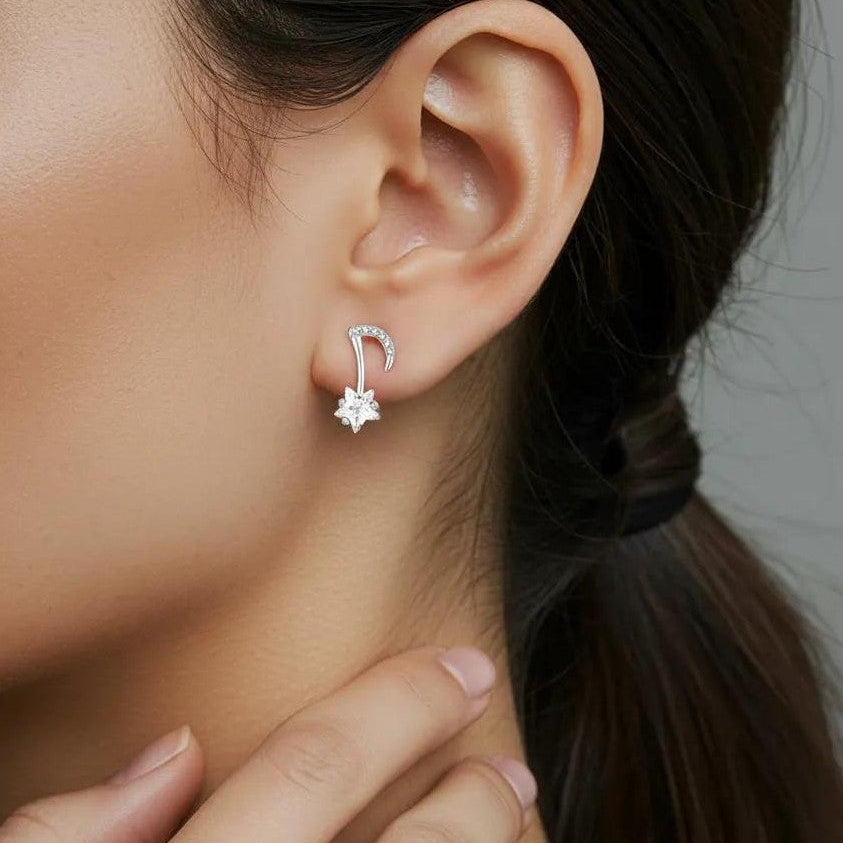 Amara Jewels gold-plated sterling silver asymmetrical music note and star earrings with cubic zirconia.