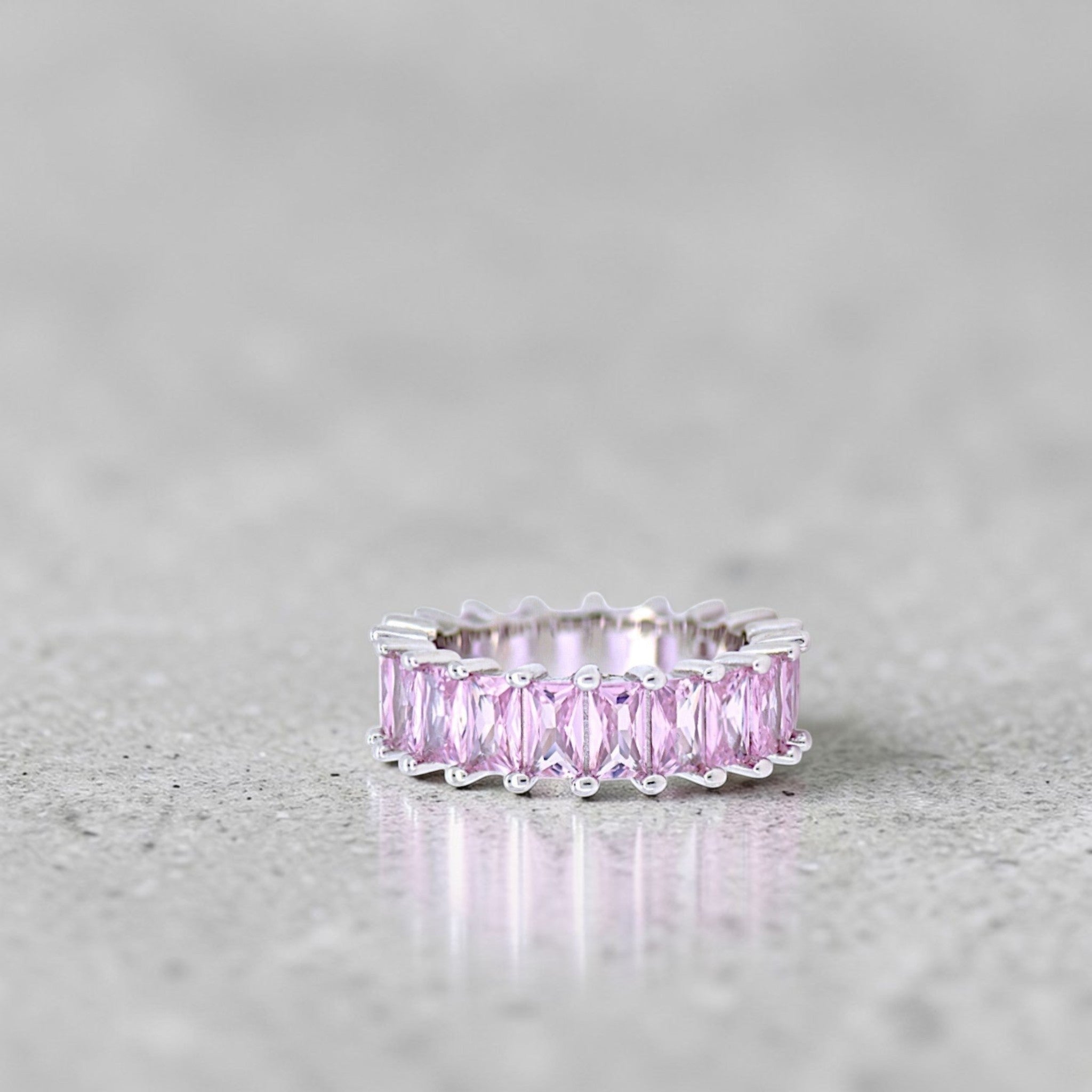 Amara Jewels pink baguette eternity ring in sterling silver with a polished finish.