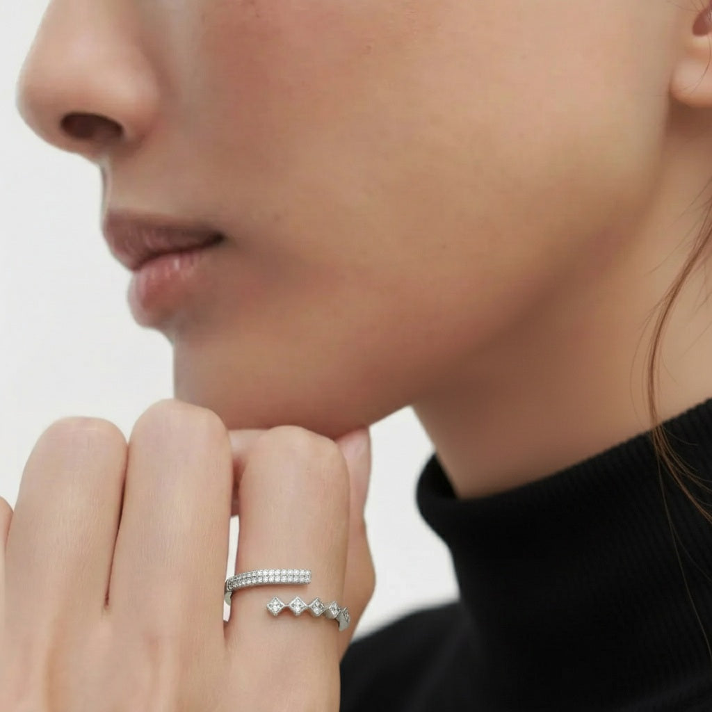 Amara Jewels sterling silver open ring with alternating cubic zirconia rhombus details and pave band.