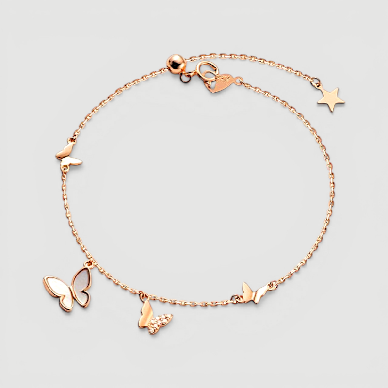 Amara Jewels rose gold plated sterling silver bracelet with butterfly and star charms, adjustable length.