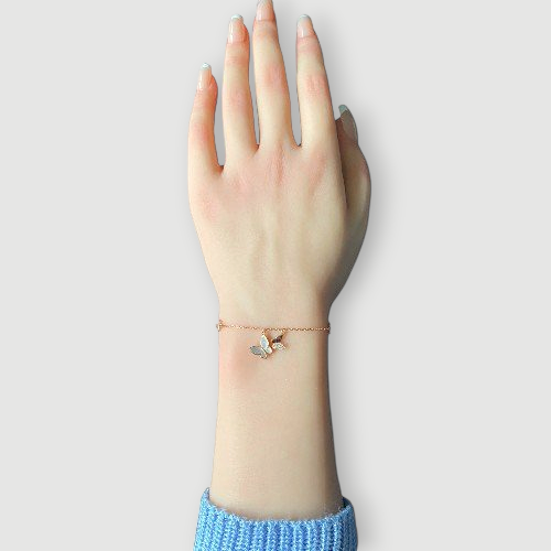 Amara Jewels rose gold plated sterling silver bracelet with butterfly and star charms, adjustable length.