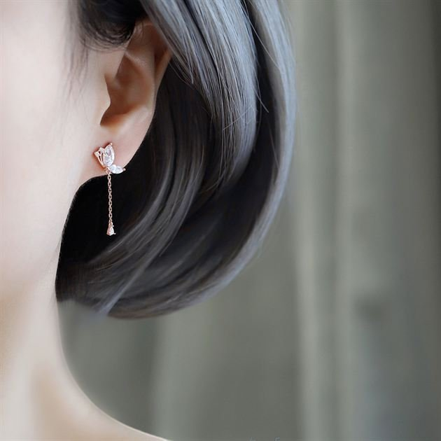 Amara Jewels rose gold plated sterling silver butterfly drop earrings with marquise and teardrop cubic zirconia stones.