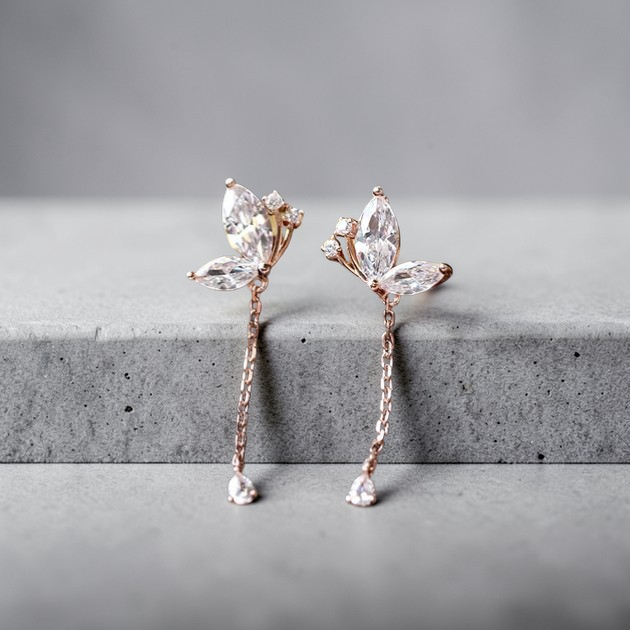Amara Jewels rose gold plated sterling silver butterfly drop earrings with marquise and teardrop cubic zirconia stones.