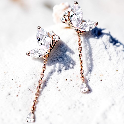 Amara Jewels rose gold plated sterling silver butterfly drop earrings with marquise and teardrop cubic zirconia stones.