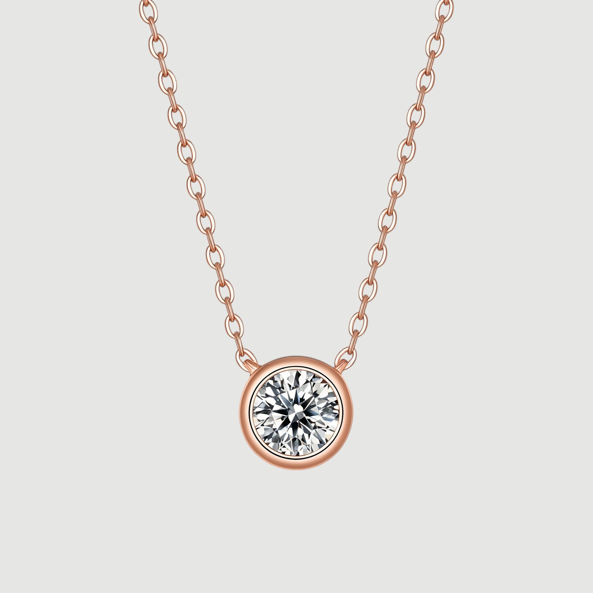 Amara Jewels rose gold 925 sterling silver necklace with a bezel-set crystal pendant.