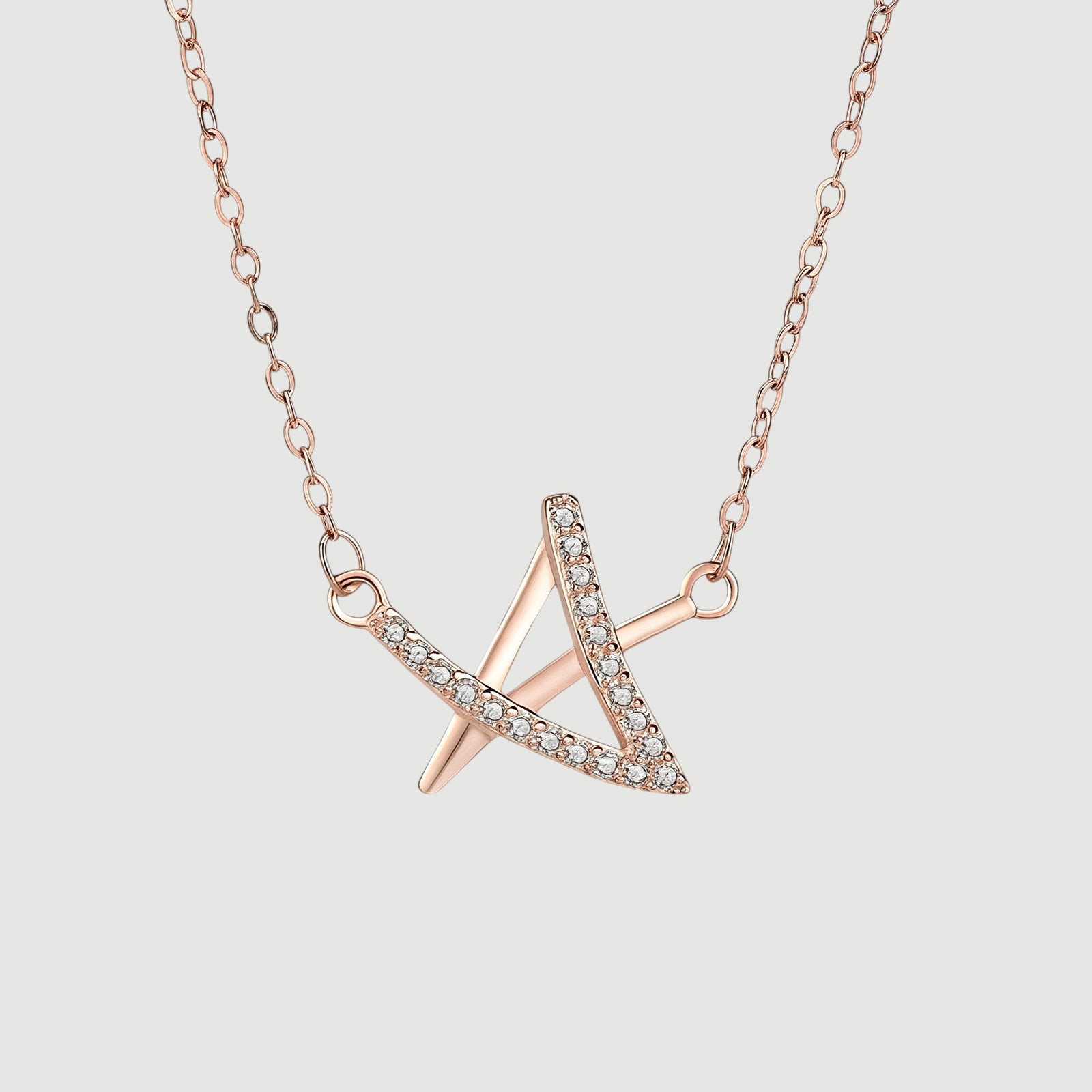 Amara Jewels rose gold geometric pendant necklace with crystals on a delicate chain.
