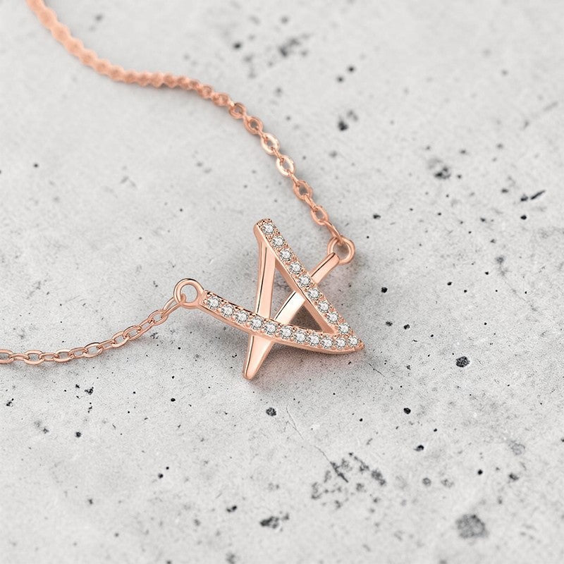 Amara Jewels rose gold geometric pendant necklace with crystals on a delicate chain.