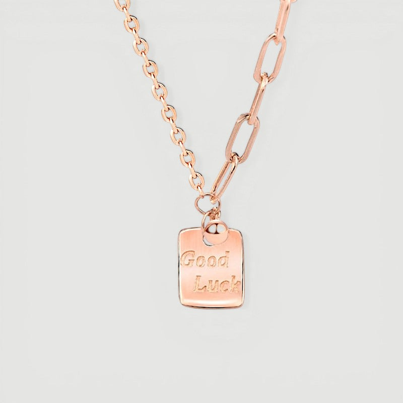 Amara Jewels rose gold plated sterling silver necklace with a square pendant engraved with "Good Luck".