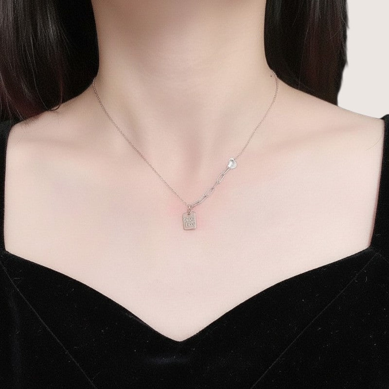 Amara Jewels rose gold plated sterling silver necklace with a square pendant engraved with "Good Luck".