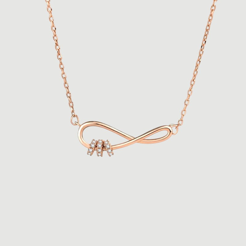 Amara Jewels rose gold plated sterling silver infinity necklace with cubic zirconia accents.