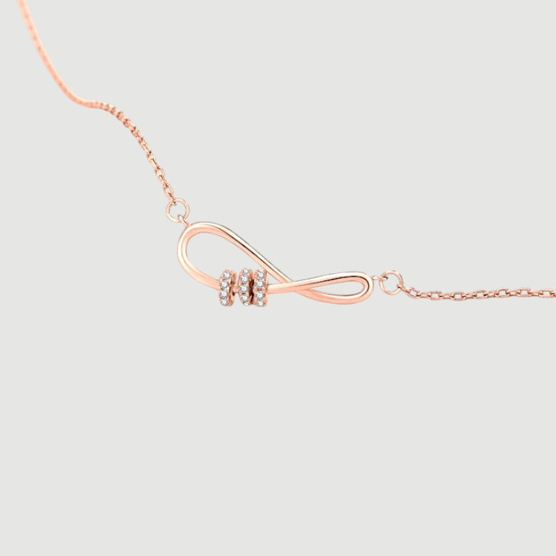 Amara Jewels rose gold plated sterling silver infinity necklace with cubic zirconia accents.