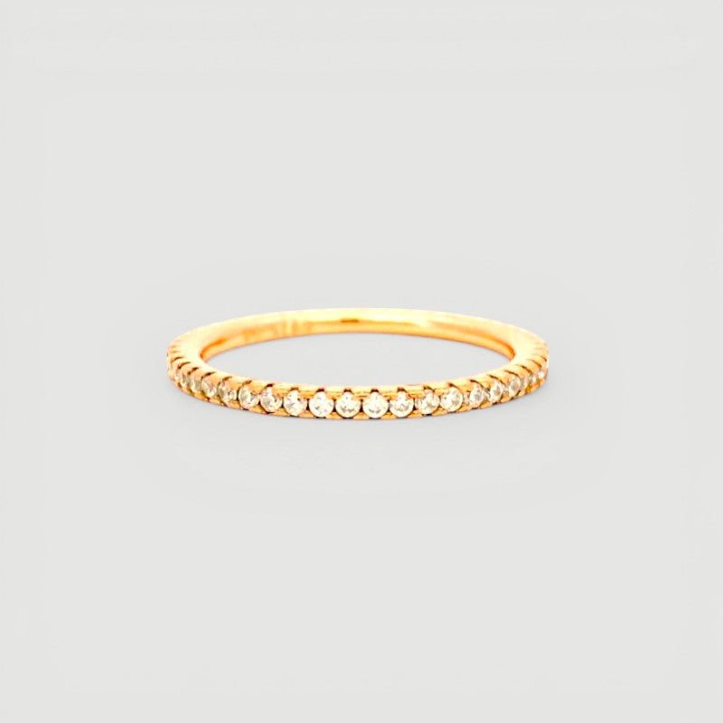 Amara Jewels rose gold stacker ring with clear stones. Minimalist band with a continuous row of shimmering stones.