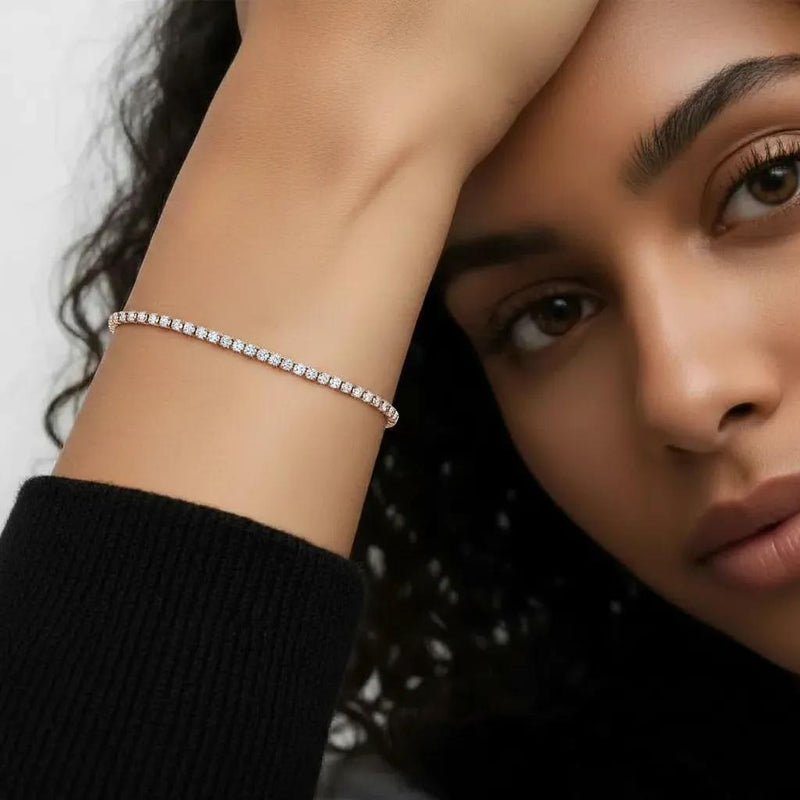 Amara Jewels rose gold adjustable tennis bracelet with white CZ stones and a slider clasp.