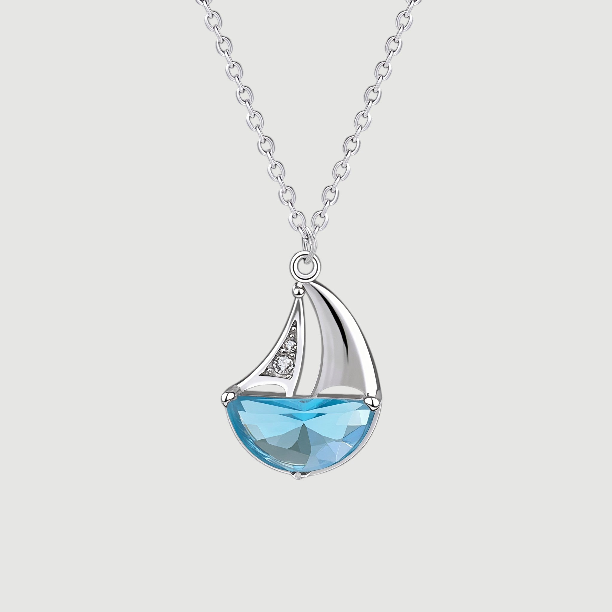 Amara Jewels 925 sterling silver sailboat necklace with blue crystal and cubic zirconia accents.