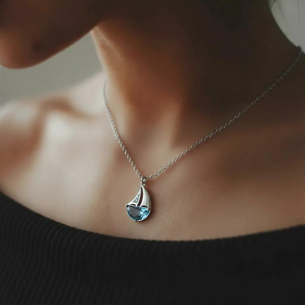 Amara Jewels 925 sterling silver sailboat necklace with blue crystal and cubic zirconia accents.