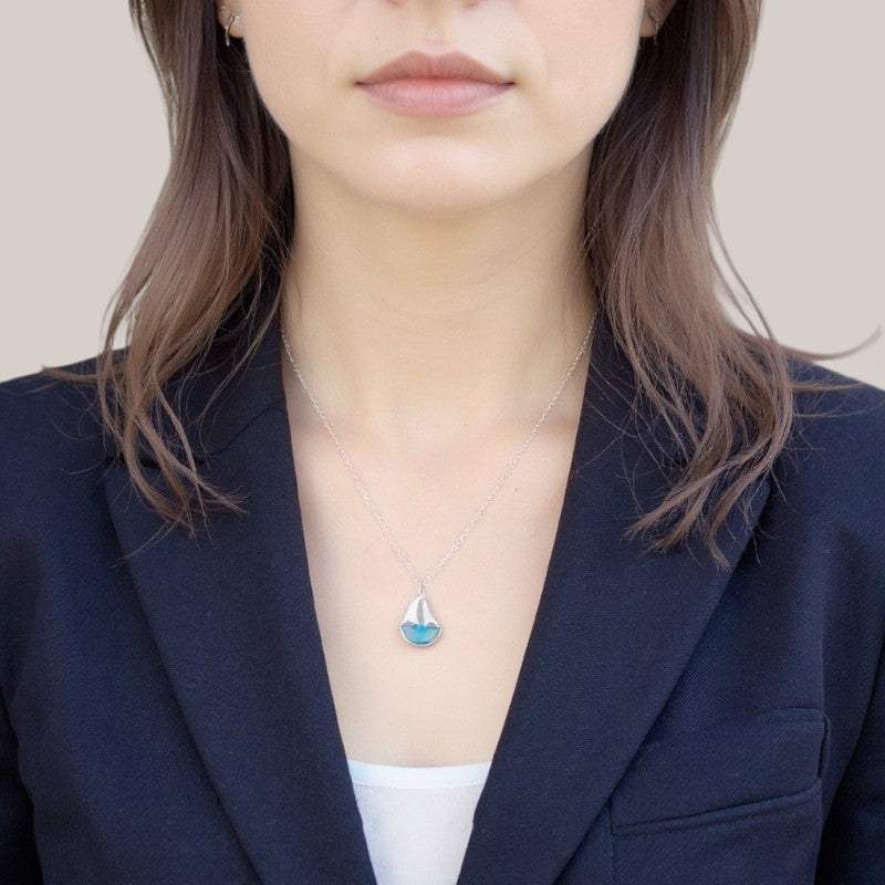Amara Jewels 925 sterling silver sailboat necklace with blue crystal and cubic zirconia accents.