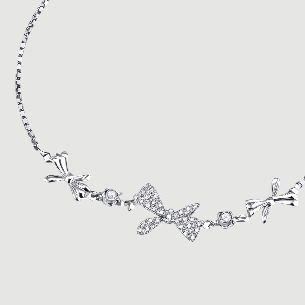 Amara Jewels 925 sterling silver adjustable bracelet with butterfly and floral charms, adorned with sparkling cubic zirconia.
