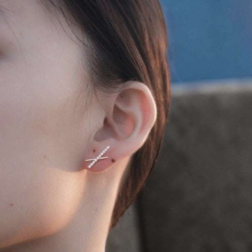Amara Jewels minimalist rhodium-plated 925 sterling silver cross bar earrings with cubic zirconia.