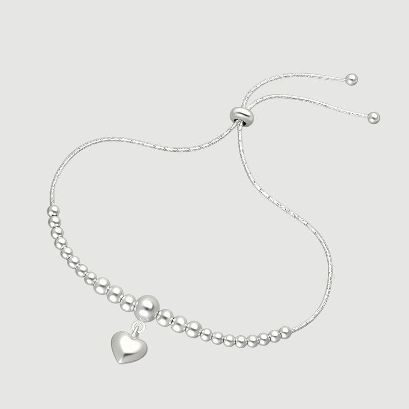 Amara Jewels sterling silver beaded bracelet with a dangling heart charm and adjustable sliding closure.