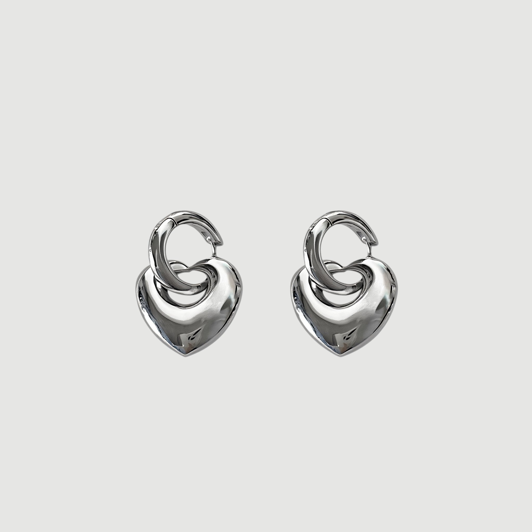Amara Jewels Sterling Silver Bold Interlocking Heart Hoop Earrings. Polished silver, modern design.