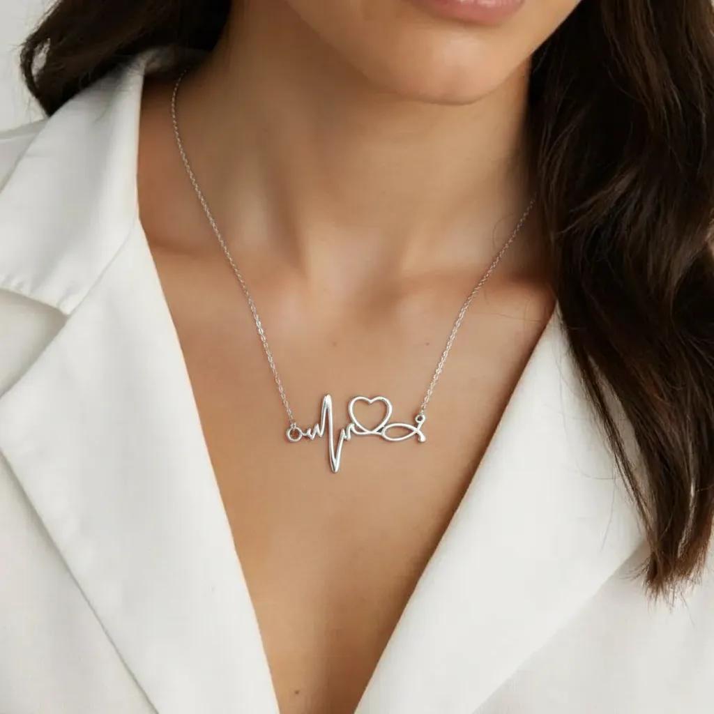 Amara Jewels silver heartbeat necklace with a heart symbol, made of sterling silver.