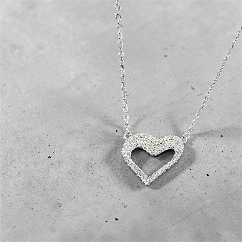 Amara Jewels silver hollow heart necklace with crystal embellishments, delicate chain.