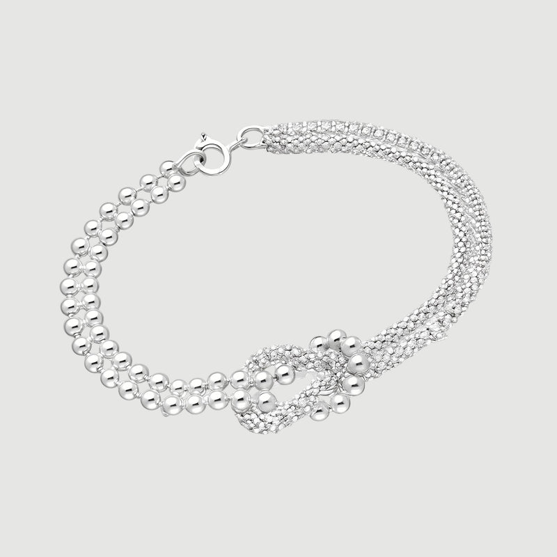 Amara Jewels sterling silver bracelet with multi-strand design and knot centerpiece, featuring polished silver beads.