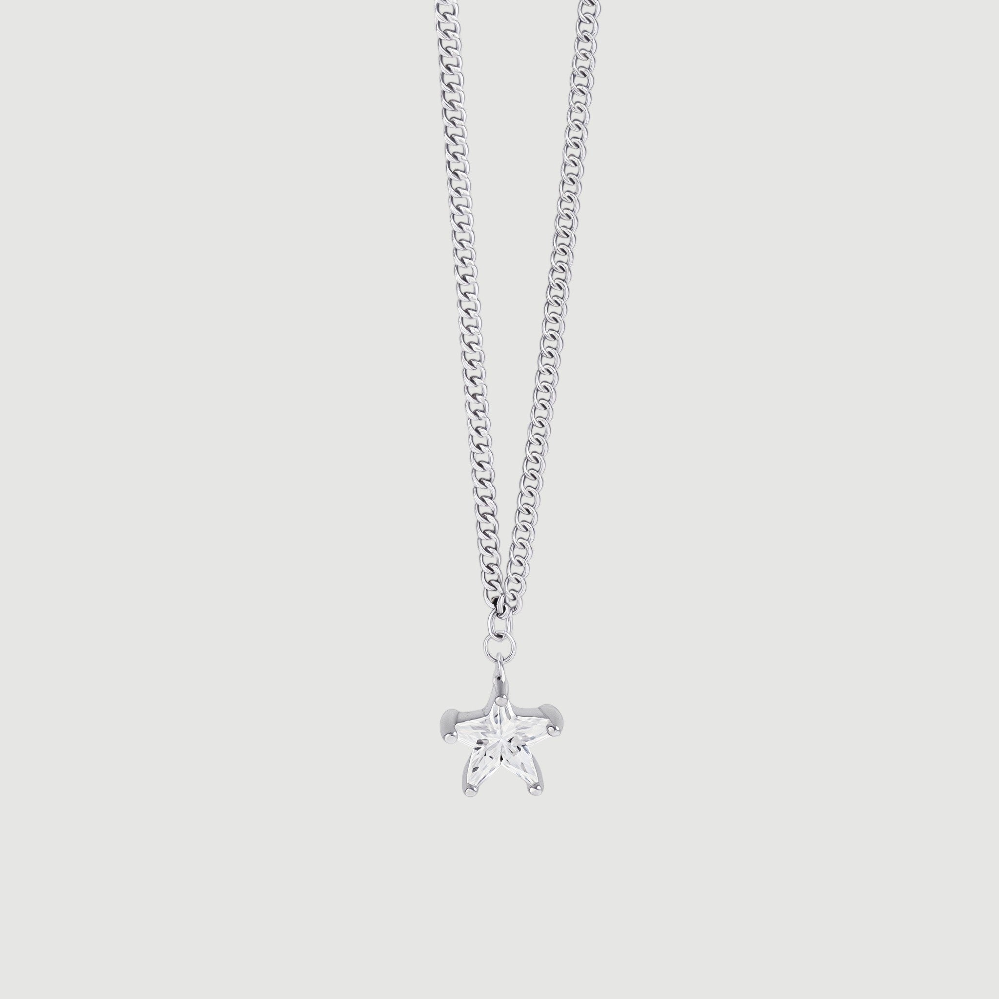 Amara Jewels silver 925 sterling silver necklace with a small, clear star pendant and a curb chain.