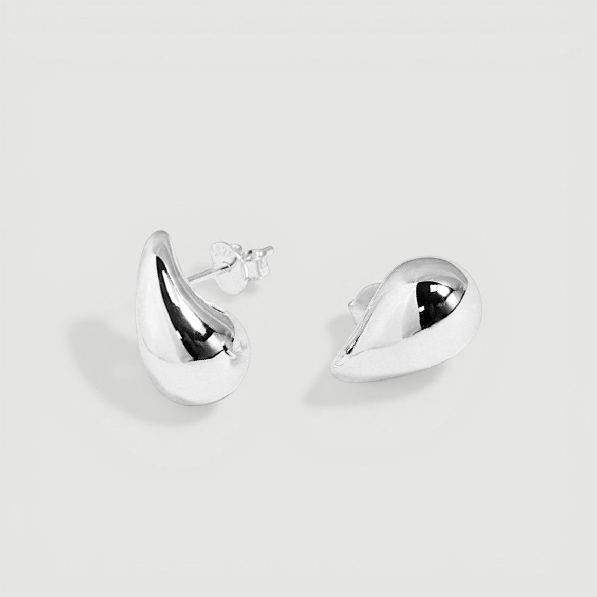 Amara Jewels polished sterling silver waterdrop stud earrings with a modern teardrop shape.