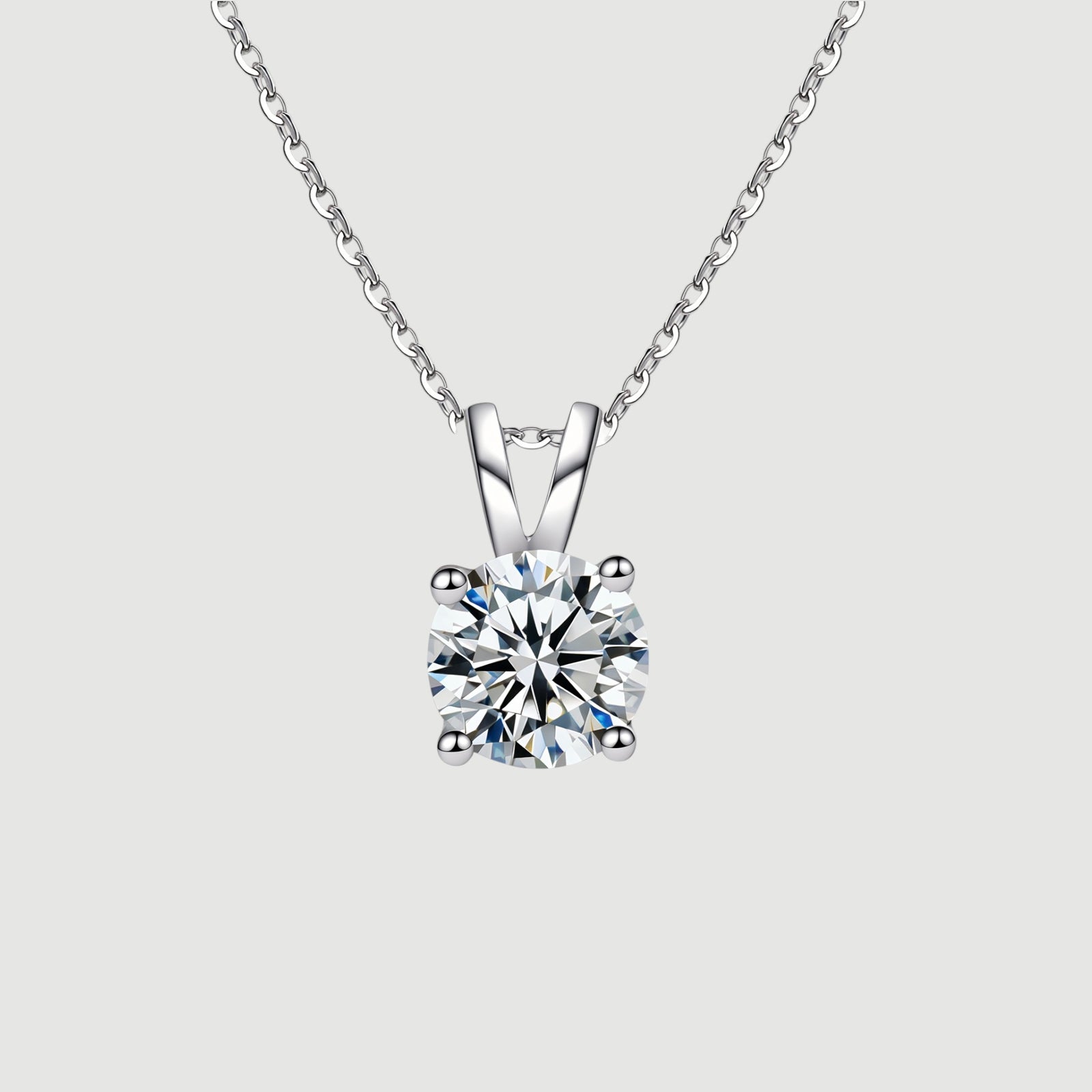 Amara Jewels 925 sterling silver solitaire pendant necklace with four-prong setting and a clear, round-cut gemstone.