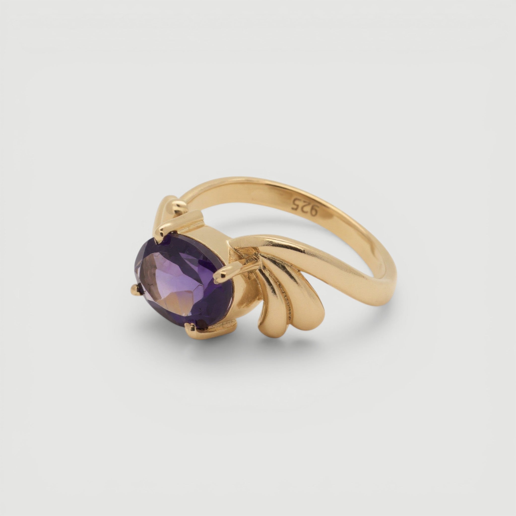 Amara Jewels gold-plated sterling silver ring with oval-cut amethyst and smaller accent stones.