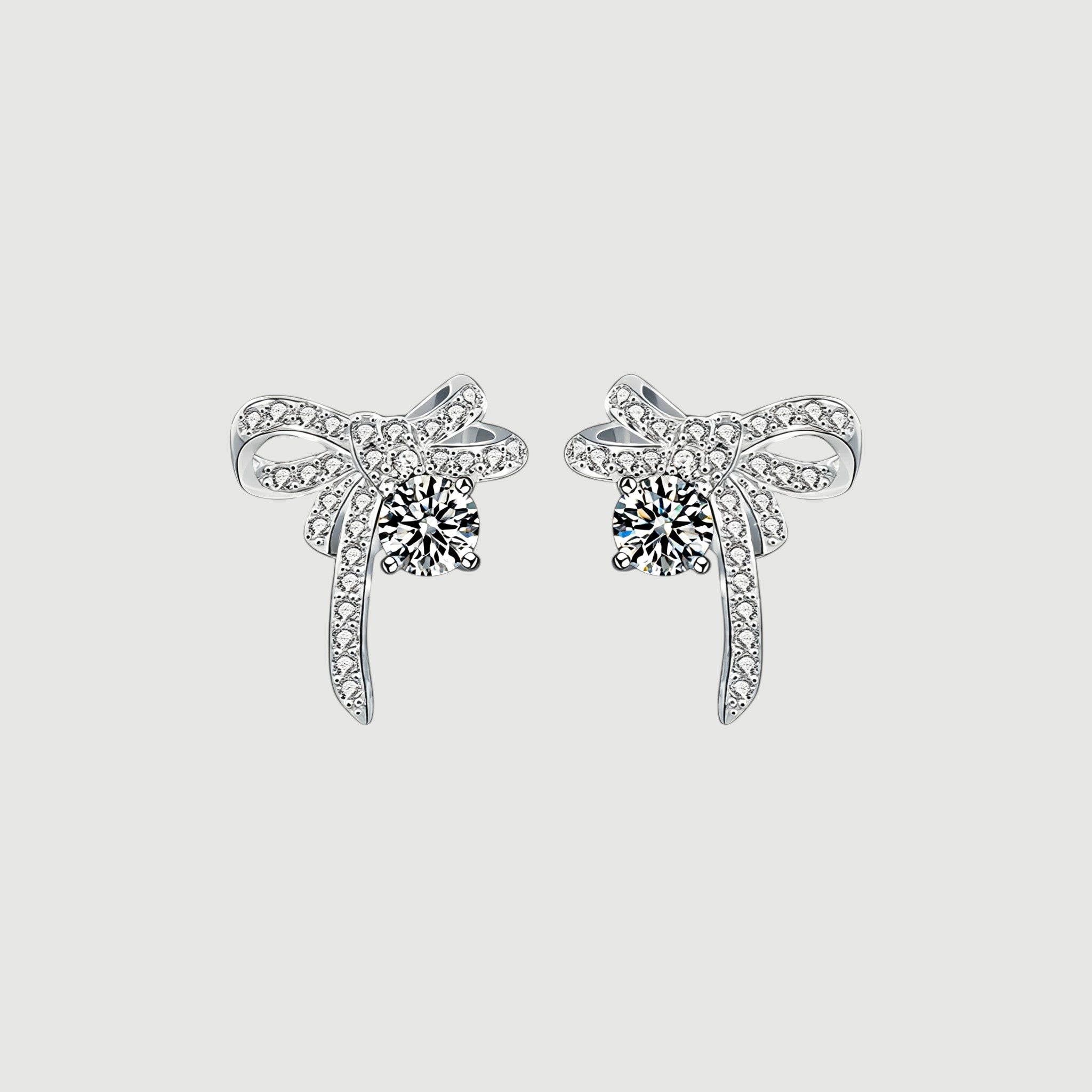 Amara Jewels Sterling Silver Bow Knot Crystal Stud Earrings with shimmering CZ crystals.