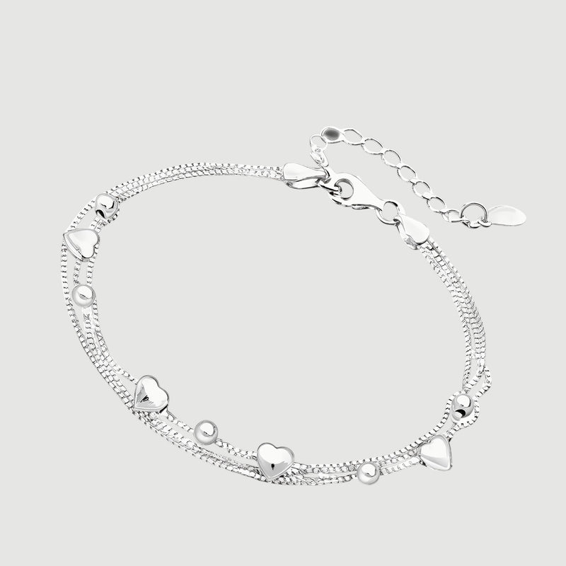 Amara Jewels delicate dual-layered sterling silver bracelet with heart charms and small beads.