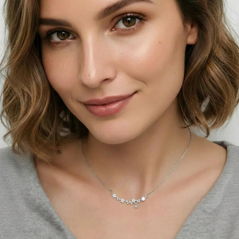 Amara Jewels 925 sterling silver necklace with delicate floral charms and sparkling cubic zirconia stones.